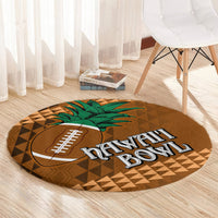 Round brown rug with green palm, football logo, Hawaii lettering, and tan geometric triangle pattern