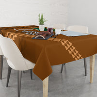 Brown bowl tablecloth with geometric triangle border and central decorative text