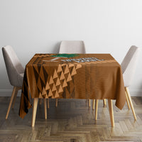 Brown bowl tablecloth with repeating geometric triangles and central team emblem