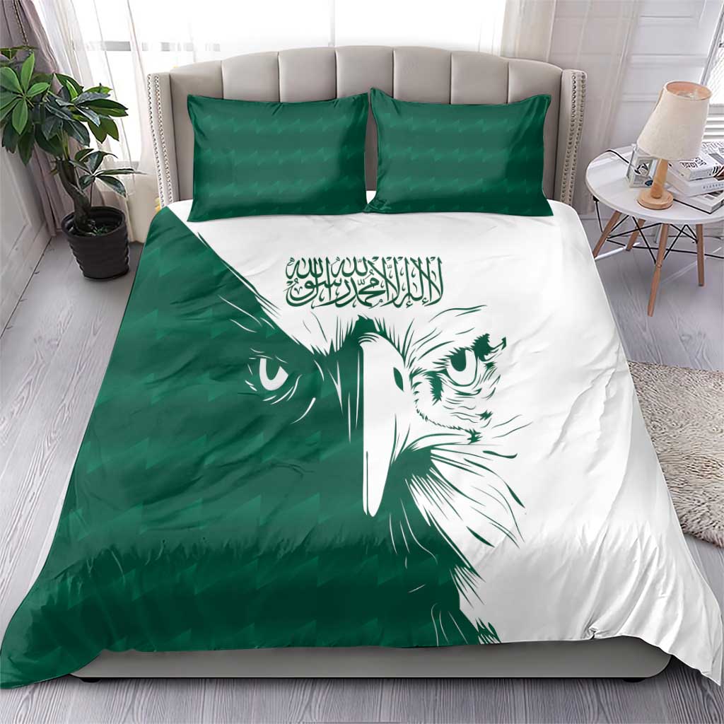 Green and white bedding set with falcon face motif, two green pillows, and duvet on bed