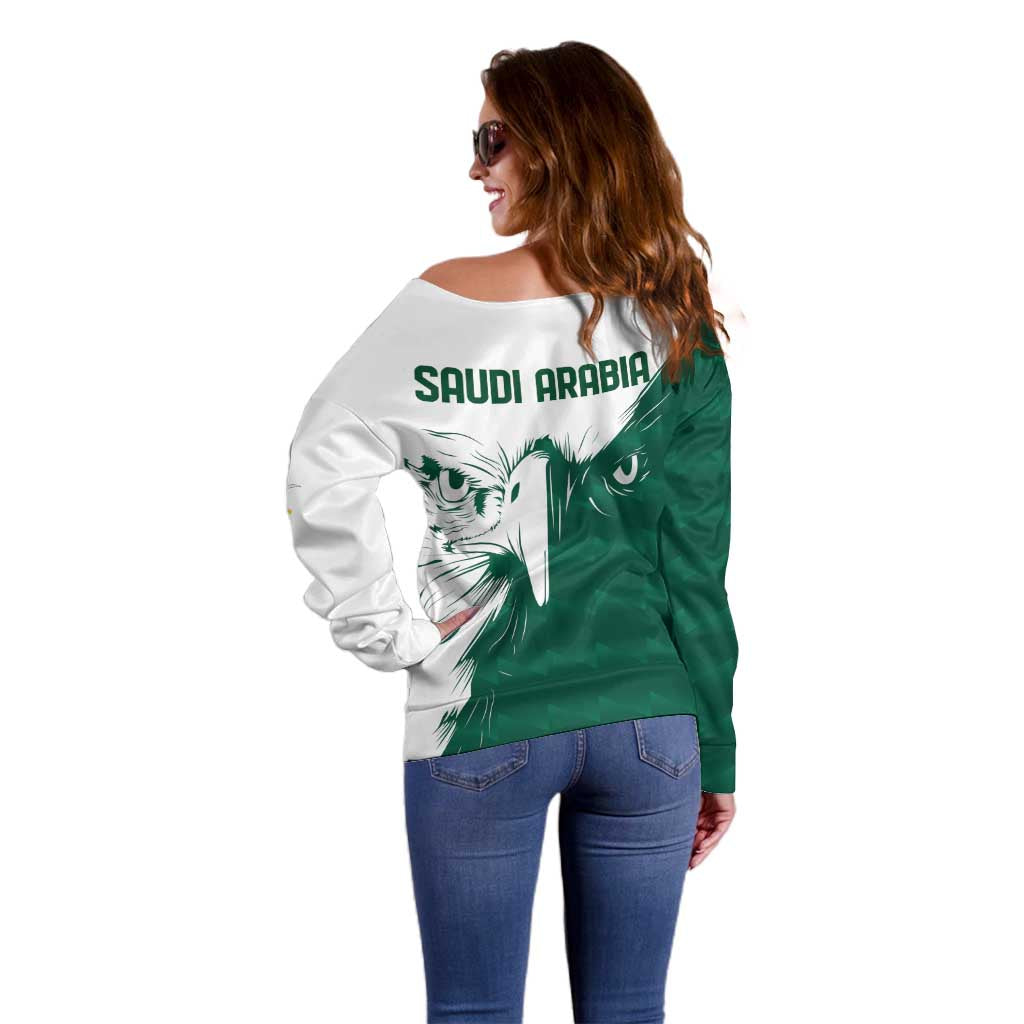Women’s off-shoulder sweater, back view in green and white with 'SAUDI ARABIA' and falcon