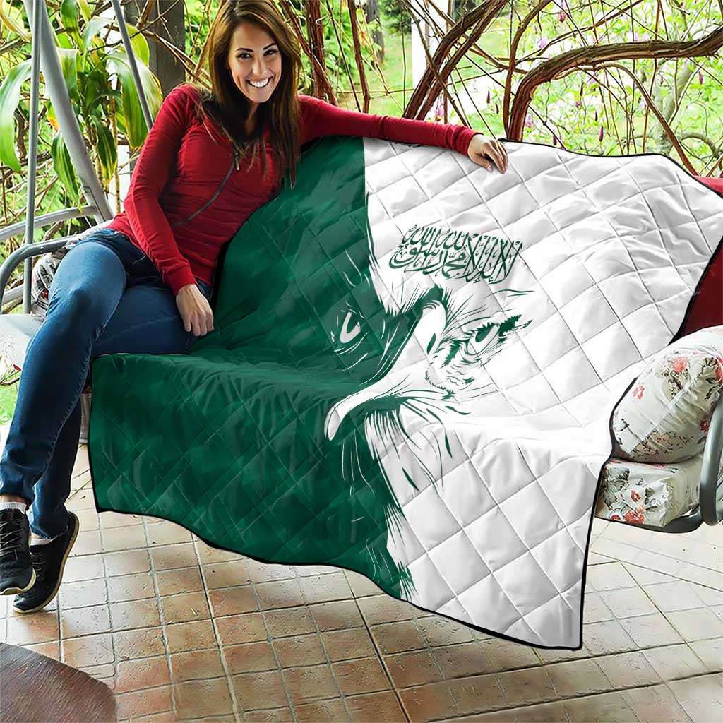 Green and white quilt with diamond quilting and a falcon illustration over two panels