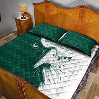 Green and white falcon quilt bed set with matching quilted pillow covers and Arabic script