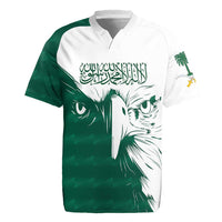 Green and white rugby jersey with eagle face graphic and Arabic text on front