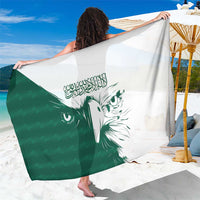 Green and white falcon sarong with Arabic calligraphy and large bird face print