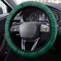 Green padded steering wheel cover with black trim, showing steering wheel controls