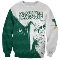 Unisex sweatshirt with green falcon graphic and Arabic calligraphy, light gray base