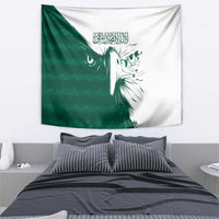 Green and white wall tapestry with split falcon face design and Arabic calligraphy