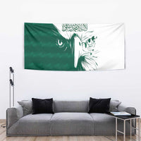 Green and white tapestry featuring Arabic calligraphy and falcon head illustration