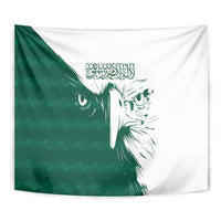 Green and white falcon tapestry with Arabic calligraphy and centered face artwork