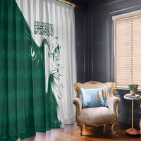 Green and white curtain panels with falcon artwork and Arabic script; hanging rings on top