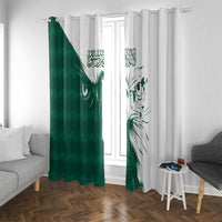Green and white window curtain panels with bold falcon design and Arabic calligraphy