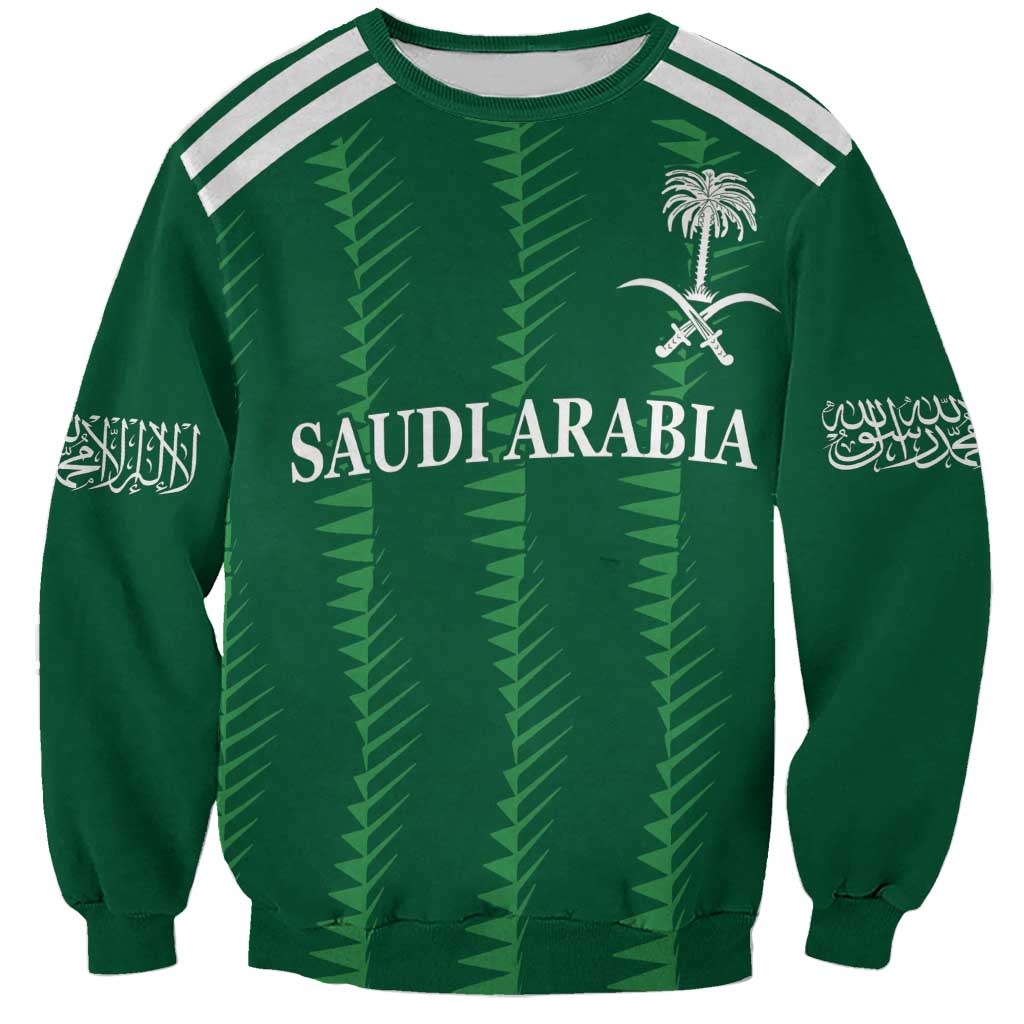 Green football sweatshirt with white shoulder stripes, Saudi Arabia crest and emblem