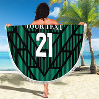 Green round beach blanket with UAE 21 design and white tassel fringe, beach wrap style