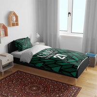 Green UAE football bedding set on bed with UAE 21 crest and geometric stripe comforter