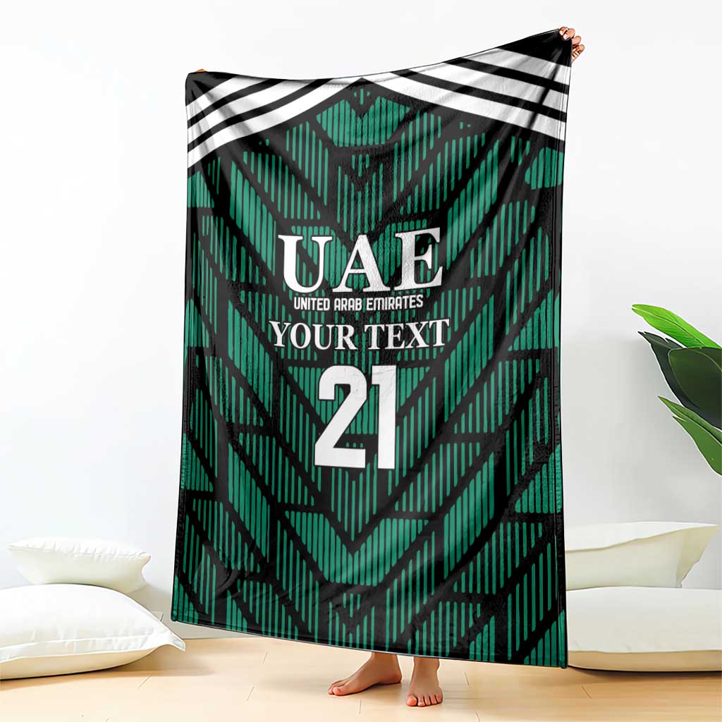Green football-themed blanket with UAE crest, 'YOUR TEXT', and number 21—draped