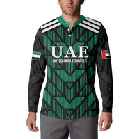 Green and black football button sweatshirt on model, with UAE graphic and striped sleeves