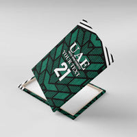 Green UAE football canvas wall art, angled view with geometric design and large "21"