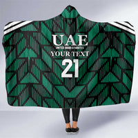Green hooded football blanket with UAE crest, number 21, and black/white striped trim