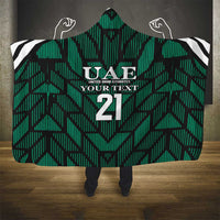 Green hooded football blanket with UAE crest, number 21, black/white striped shoulders