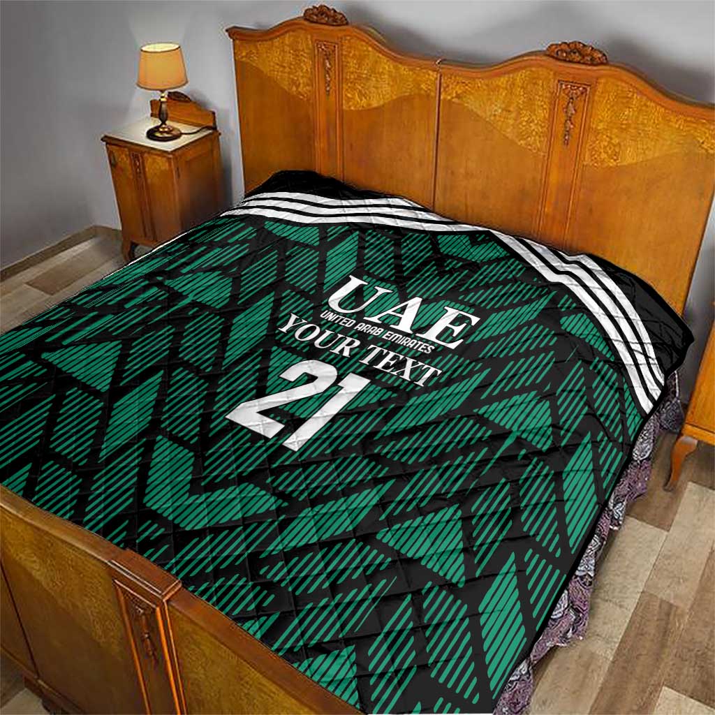 Custom UAE football quilt on bed, green geometric print with white stripes and 21