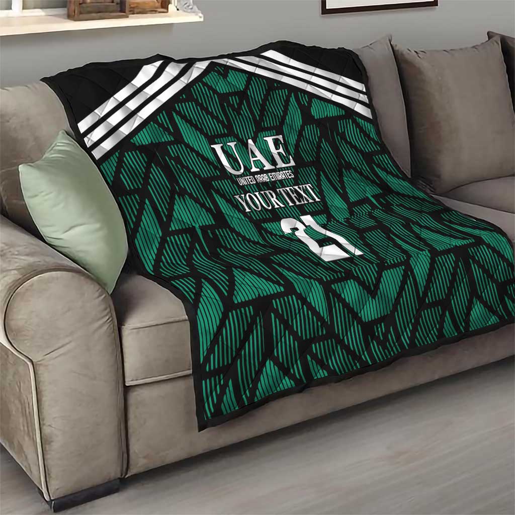 Custom UAE football quilt on couch, green patterned throw with white stripes and 21