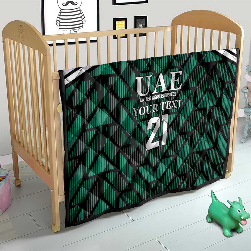 Custom UAE football quilt in crib, green geometric print with white stripes and 21