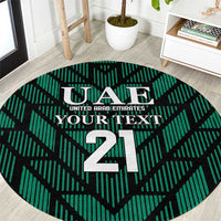 Round green football carpet with UAE crest and large 21 center design