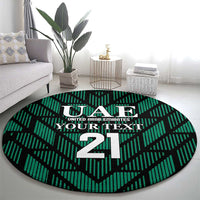 Round green football carpet featuring UAE crest and large 21 on zigzag pattern