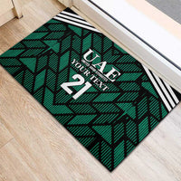 Green UAE football rubber doormat corner view, black/white stripes and number 21
