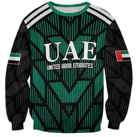 Green-and-black football sweatshirt with crew neck, striped shoulders, UAE crest front print
