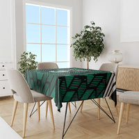 Green football tablecloth with UAE and '21' design on dining table