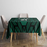 Green football tablecloth with UAE '21' graphic centered on dining table
