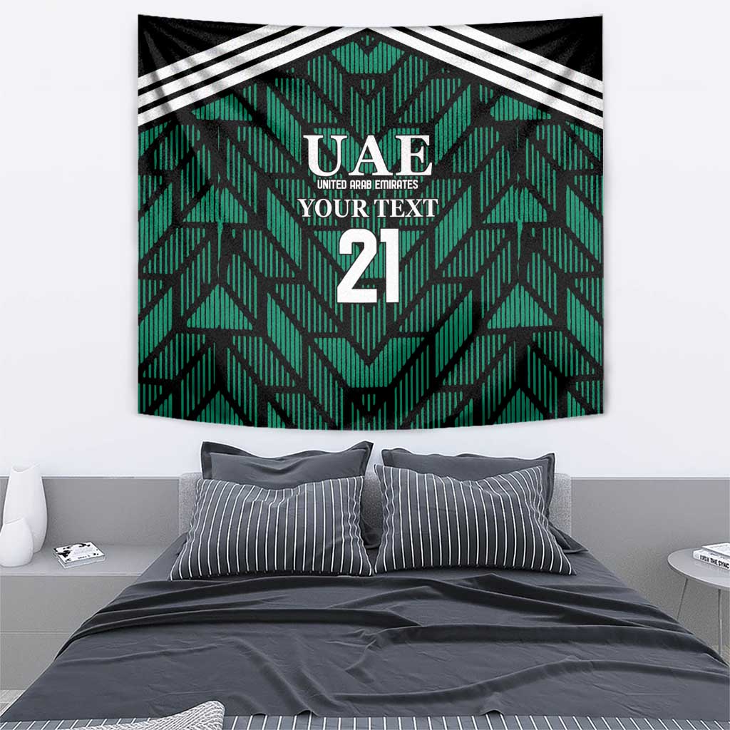 Rectangular green tapestry with UAE logo, 'YOUR TEXT', number 21, and diagonal stripe trim.