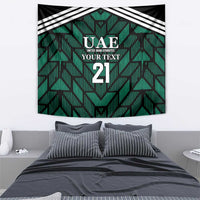 Rectangular green tapestry with UAE logo, 'YOUR TEXT', number 21, and diagonal stripe trim.