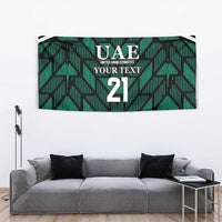 Green rectangular tapestry featuring UAE branding, 'YOUR TEXT', and number 21.