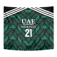 Close-up view of green football tapestry with UAE crest, 'YOUR TEXT', and number 21.