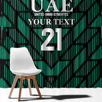 Green patterned window curtain with UAE logo, YOUR TEXT, and large number 21.