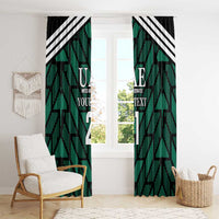 Green window curtain panels with UAE text, black geometric pattern, and number print.