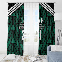 Green window curtain panels with UAE text and bold number print, black-and-white stripes.