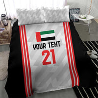 Close view of football bedding set: black duvet with white jersey design, red side stripes, number 21