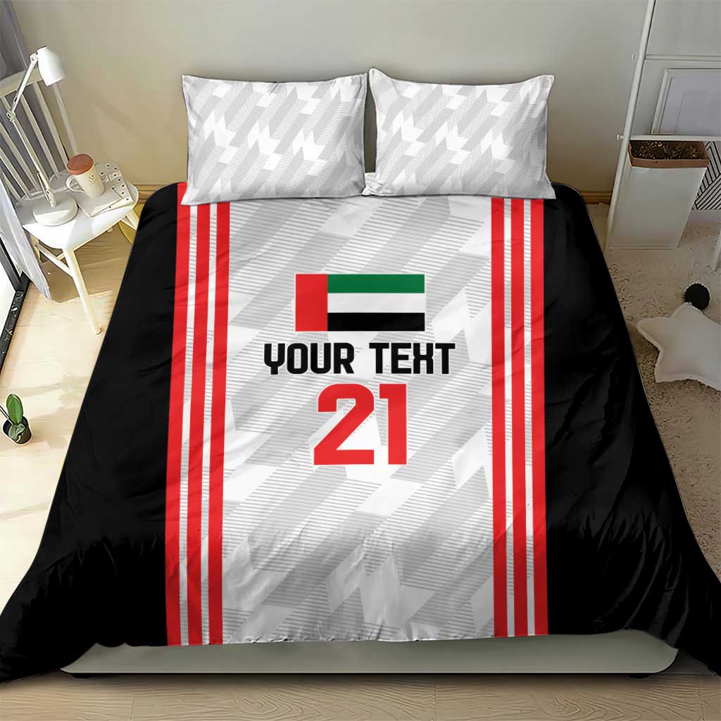 Football bedding set on bed with 2 pillows: black duvet, red striped jersey panel, number 21