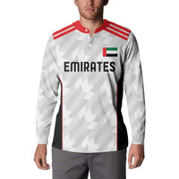 Men's white football button sweatshirt on model, red collar, Emirates front print, long sleeves