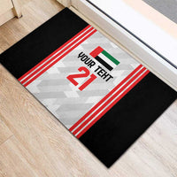 Custom rubber doormat with black border and central “YOUR TEXT 21” graphic and UAE flag