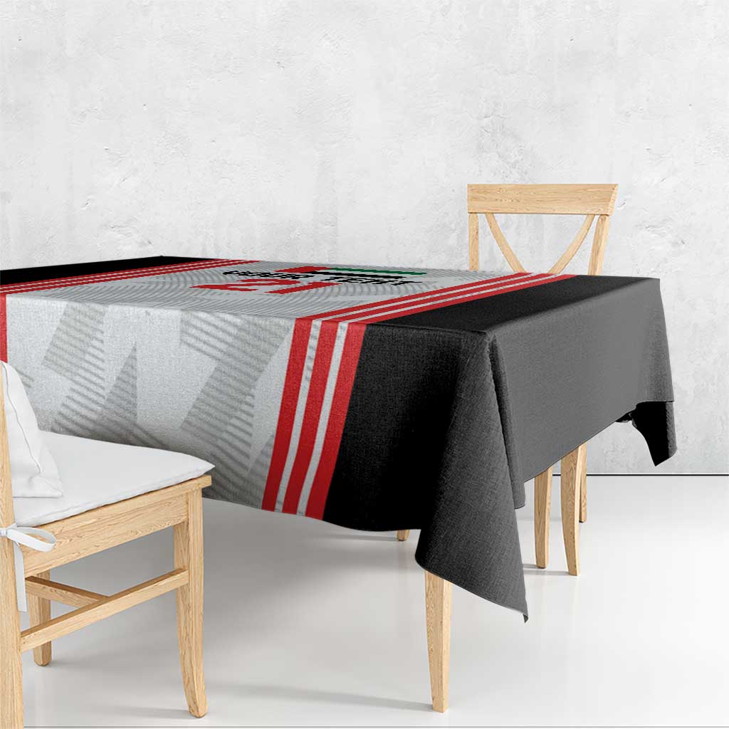 Black and white football tablecloth with red vertical stripes and folded side drape