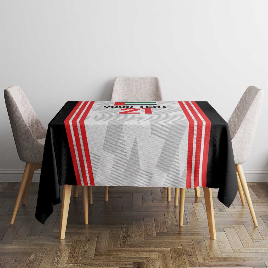 Football tablecloth on round table: black base with red stripe bands and light gray center