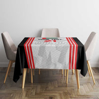 Football tablecloth on round table: black base with red stripe bands and light gray center