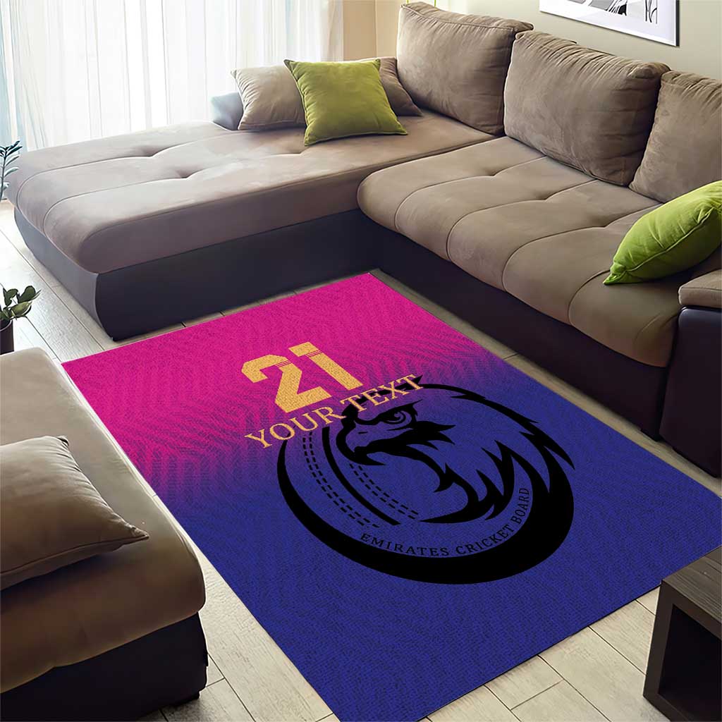 Custom cricket area rug with pink highlight, blue center, large falcon emblem