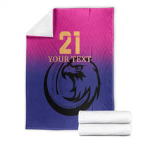 Cricket blanket folded and stacked with white towels, pink and blue falcon 21 print