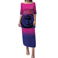 Pink long cricket dress with UAE graphic and falcon emblem, round neckline